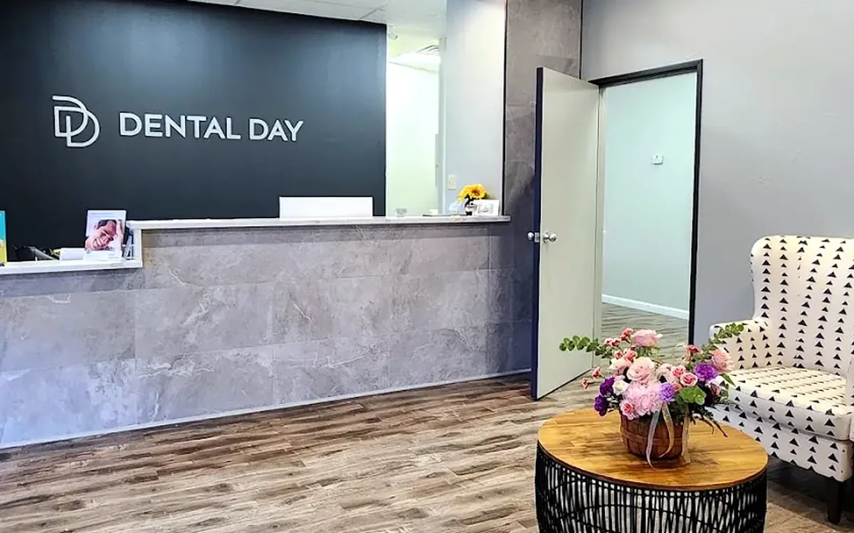 The Dental Day waiting lounge with its striped couch and warm daylight